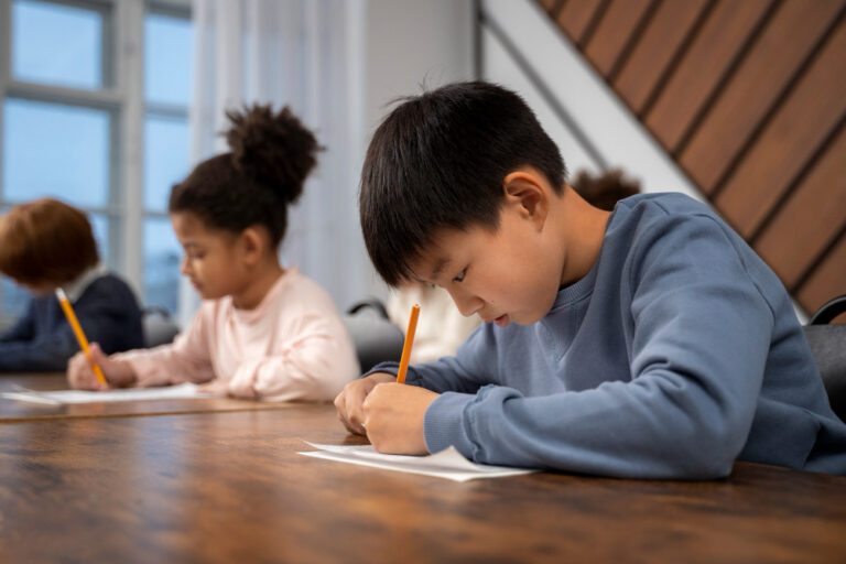 Medium shot kid answering at school test using pencil